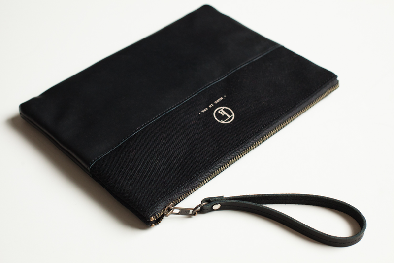 Illustration for article titled A Sturdy Black Clutch That Holds Almost Anything